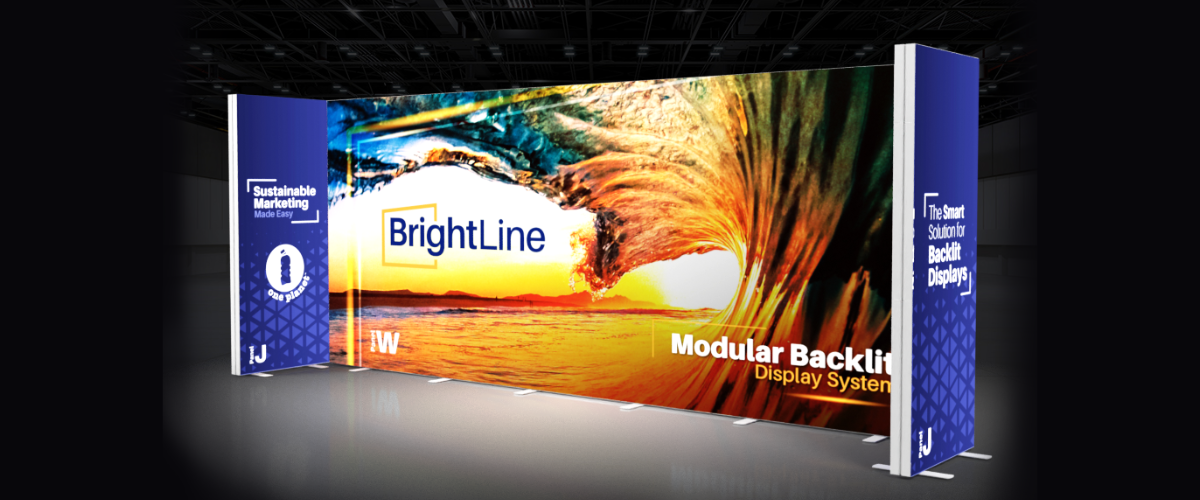 BrightLine modular backlit display wall at a trade show with blue branding panels on the sides, sunset graphic in the center.